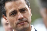 Mexican President Enrique Pena Nieto listens to an attendee at the annual Allen and Co. conference at the Sun Valley