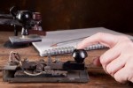 hand-tapping-morse-code-on-an-antique-telegraph-machine